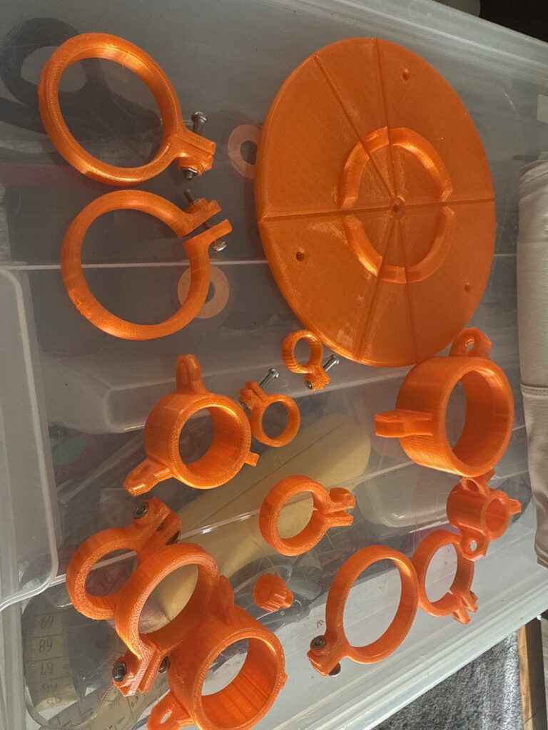 Orange 3D printed guide rings for Spiderbeam fibreglass masts