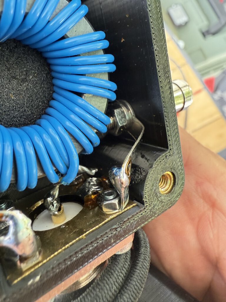 Inside the antenna matching box: toroid with blue windings