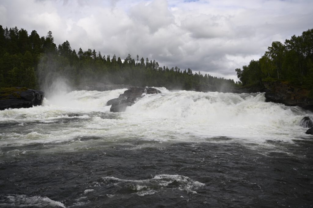 Wide waterfall under a cloudy sky, Norway