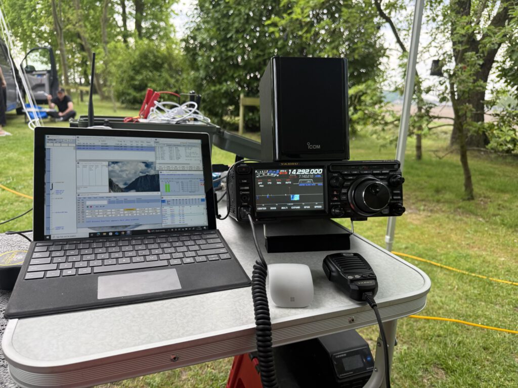 Icom transceiver and laptop logging outdoors