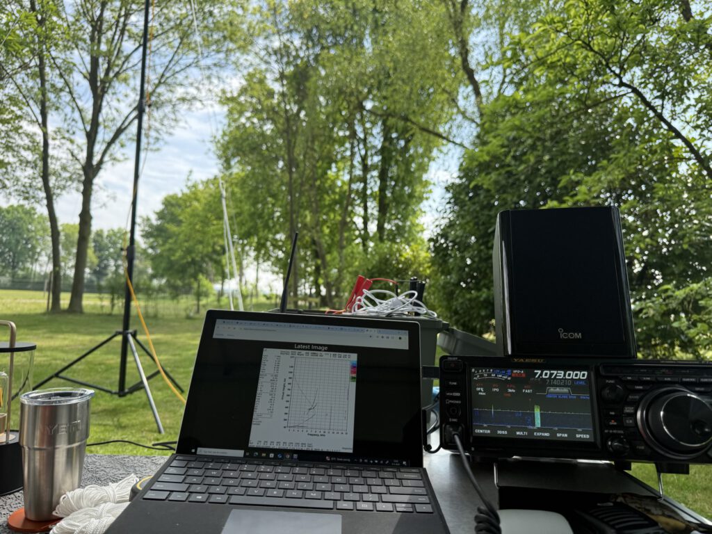 Icom radio and laptop on the camping table