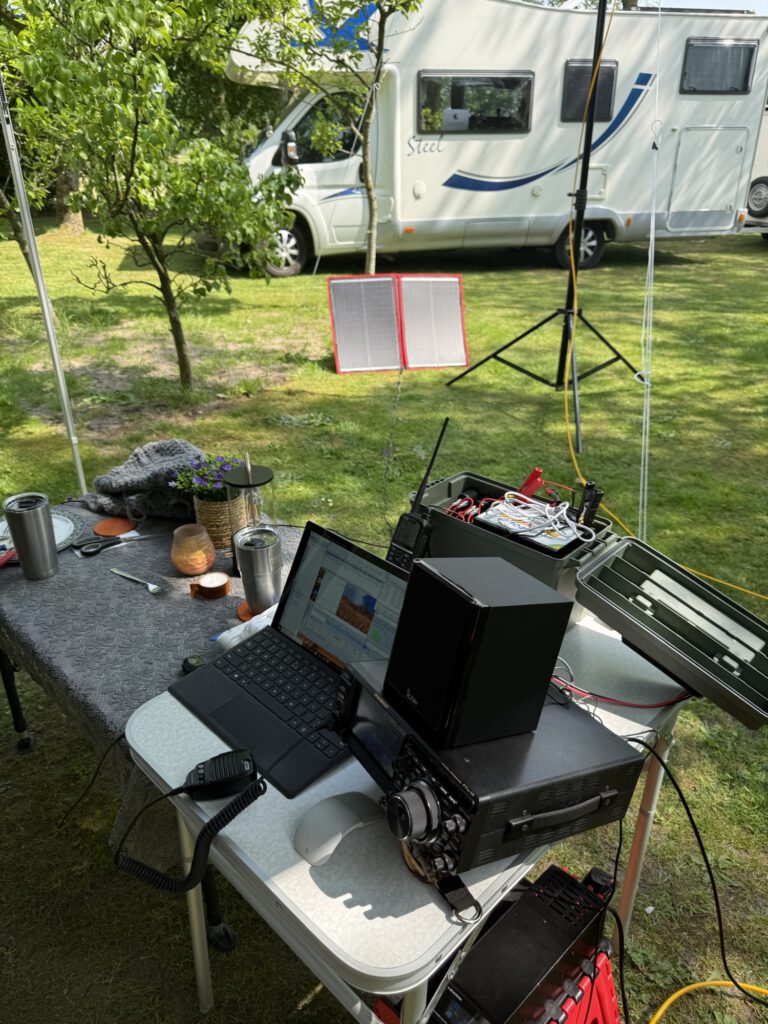 Radio table set up in front of the camper