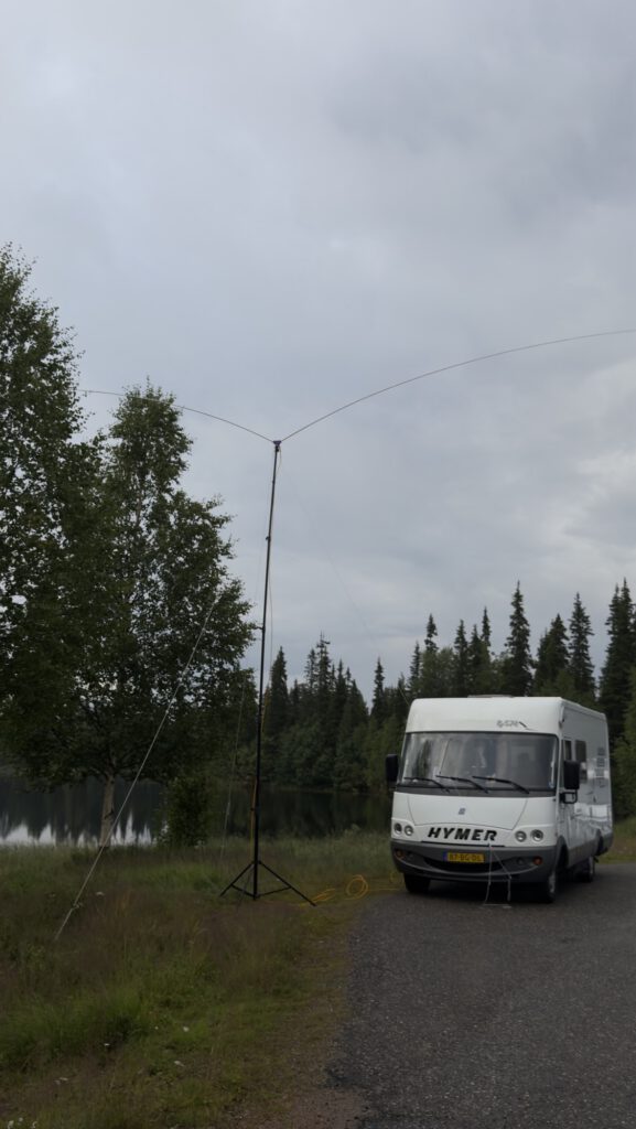 Mobile home and antenna on a forest spot in Finland