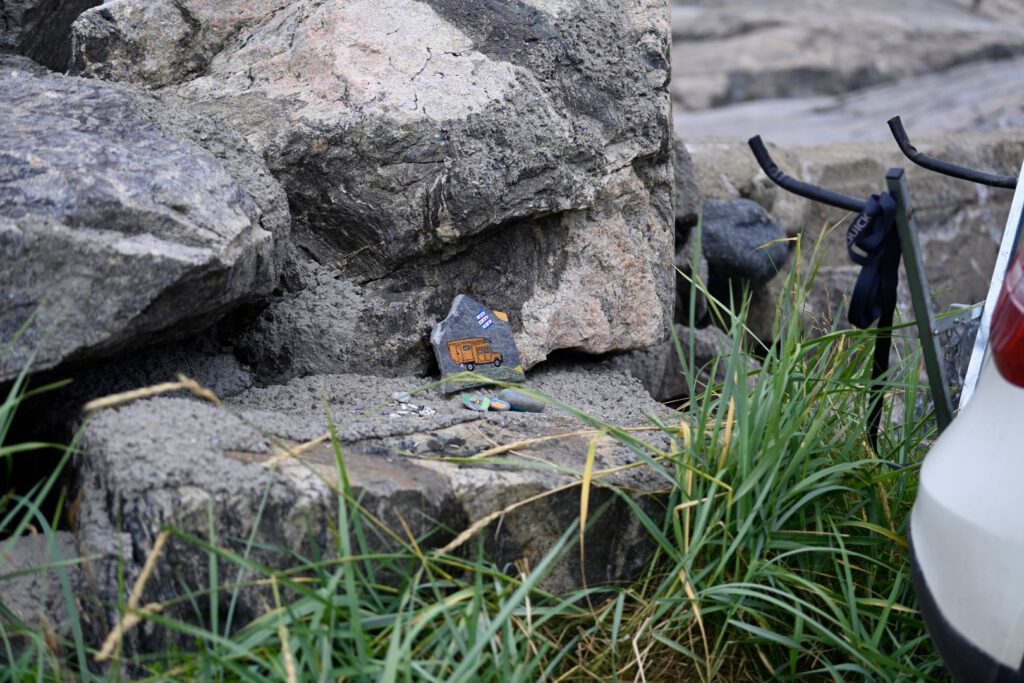 Painted stone between the rocks