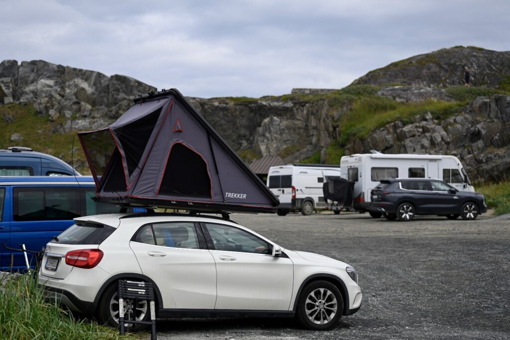 Campers and a roof tent at the parking place