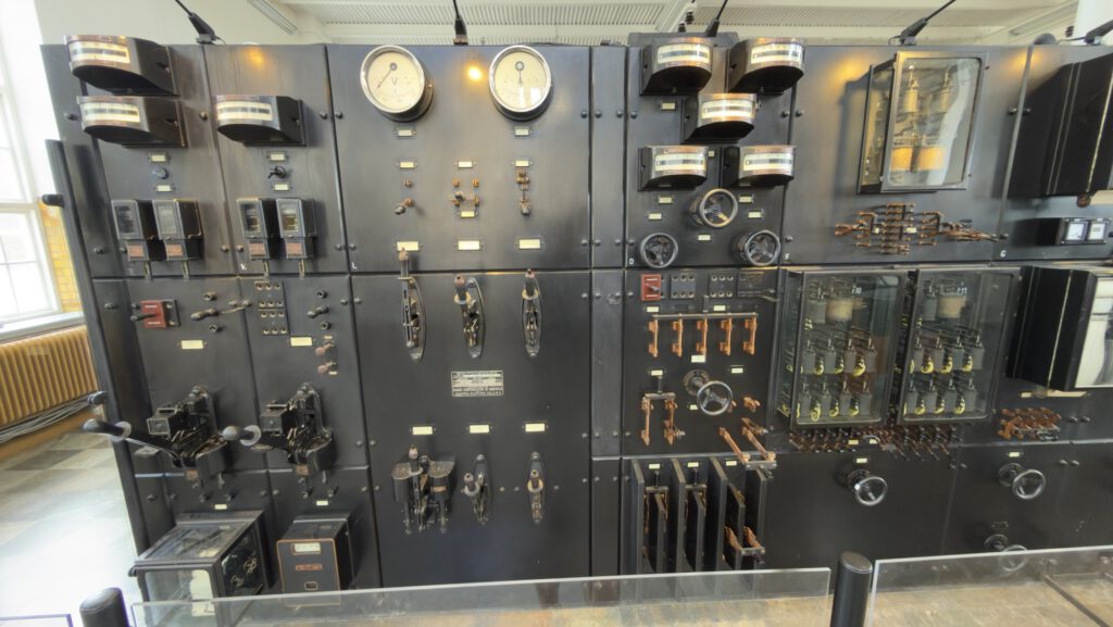 Black control panel with meters and switches