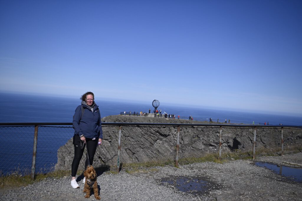 On the cliff at the North Cape with the dog