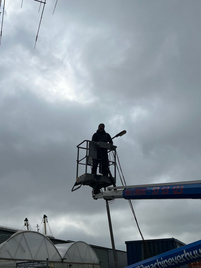 Working on the antennas from a cherry picker